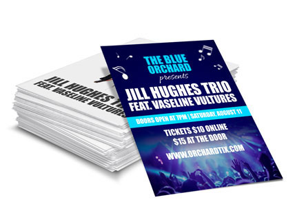 Stack of business flyers promoting a concert
